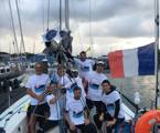 The crew of 41 SUD celebrate their arrival at the finish in Noumea